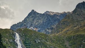 Preview wallpaper mountains, slope, waterfall, house, grass, nature