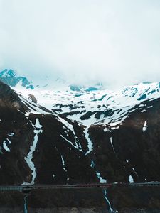 Preview wallpaper mountains, snow, clouds, slope, cliff