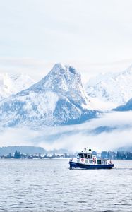 Preview wallpaper mountains, snow, clouds, boat, sea