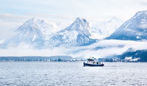 Preview wallpaper mountains, snow, clouds, boat, sea