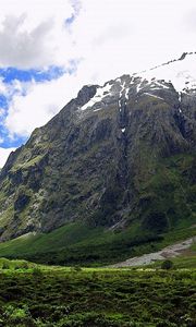 Preview wallpaper mountains, snow, greens, height, sky, greatness