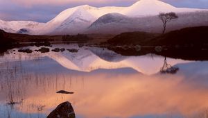 Preview wallpaper mountains, snow, lake, reflection, mirror, evening