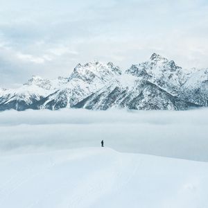 Preview wallpaper mountains, snow, man, silhouette, alone