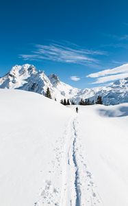 Preview wallpaper mountains, snow, skier, path, snowy