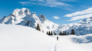 Preview wallpaper mountains, snow, skier, path, snowy