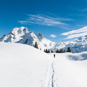 Preview wallpaper mountains, snow, skier, path, snowy