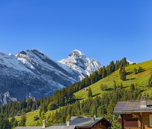 Preview wallpaper mountains, snow, slope, trees, house, nature