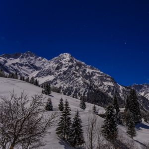 Preview wallpaper mountains, snow, slope, trees, view, landscape, night
