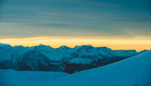 Preview wallpaper mountains, snow, sunset, horizon, sky, snowy