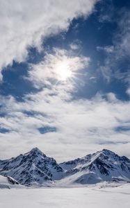 Preview wallpaper mountains, snow, winter, clouds, sky, rays, sun