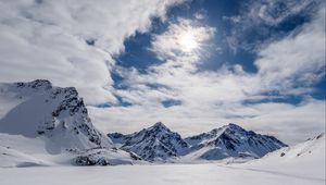 Preview wallpaper mountains, snow, winter, clouds, sky, rays, sun