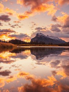 Preview wallpaper mountains, spruce, trees, sunset, reflection, clouds