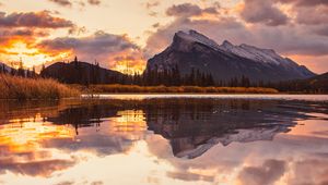 Preview wallpaper mountains, spruce, trees, sunset, reflection, clouds