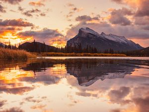 Preview wallpaper mountains, spruce, trees, sunset, reflection, clouds