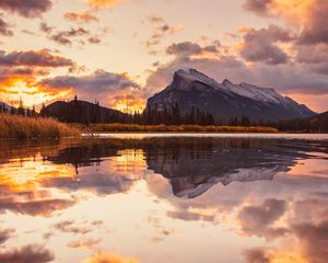 Preview wallpaper mountains, spruce, trees, sunset, reflection, clouds