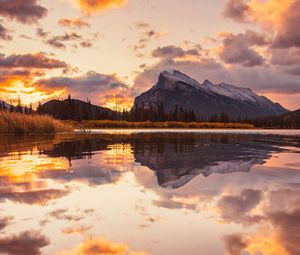 Preview wallpaper mountains, spruce, trees, sunset, reflection, clouds