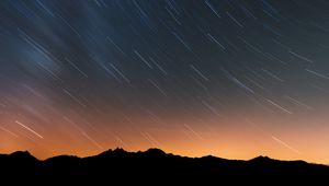 Preview wallpaper mountains, starry sky, night, outlines, dark, long exposure