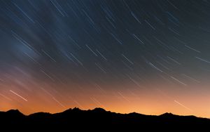 Preview wallpaper mountains, starry sky, night, outlines, dark, long exposure