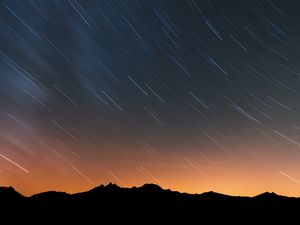 Preview wallpaper mountains, starry sky, night, outlines, dark, long exposure