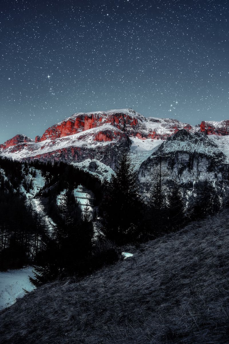 Download Wallpaper 800x1200 Mountains Starry Sky Peaks Snow Grass