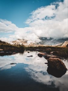 Preview wallpaper mountains, stones, grass, clouds, lake