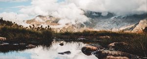 Preview wallpaper mountains, stones, grass, clouds, lake