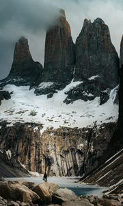 Preview wallpaper mountains, stones, lake, man, alone, winter