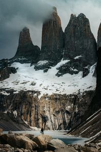 Preview wallpaper mountains, stones, lake, man, alone, winter