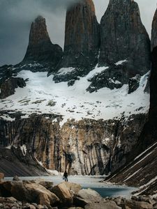 Preview wallpaper mountains, stones, lake, man, alone, winter