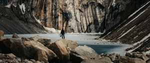 Preview wallpaper mountains, stones, lake, man, alone, winter