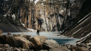 Preview wallpaper mountains, stones, lake, man, alone, winter