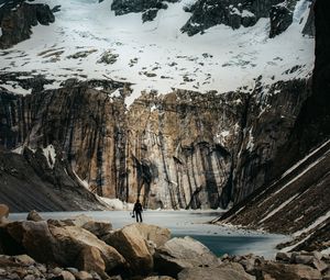 Preview wallpaper mountains, stones, lake, man, alone, winter