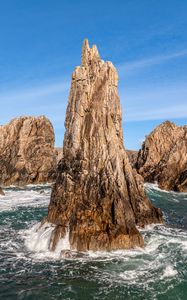 Preview wallpaper mountains, stones, rocks, sea, sea foam, nature, sky