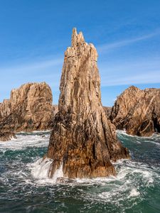 Preview wallpaper mountains, stones, rocks, sea, sea foam, nature, sky