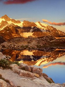 Preview wallpaper mountains, stones, sky, shades, water, reflection, clouds