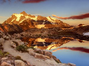 Preview wallpaper mountains, stones, sky, shades, water, reflection, clouds