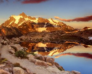 Preview wallpaper mountains, stones, sky, shades, water, reflection, clouds