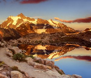 Preview wallpaper mountains, stones, sky, shades, water, reflection, clouds