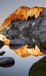 Preview wallpaper mountains, stones, water, shades, rocks, coast