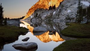 Preview wallpaper mountains, stones, water, shades, rocks, coast