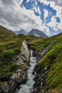 Preview wallpaper mountains, stream, stones, grass, relief