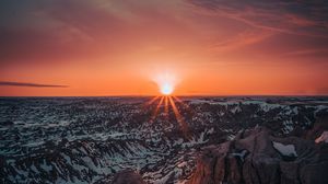 Preview wallpaper mountains, sun, sunset, sunlight, horizon, snowy