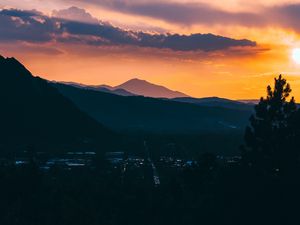 Preview wallpaper mountains, sunset, aerial view, village, clouds