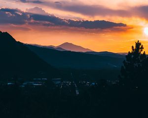 Preview wallpaper mountains, sunset, aerial view, village, clouds