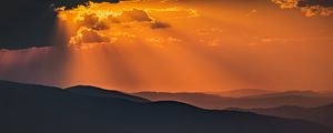Preview wallpaper mountains, sunset, clouds, rays, dusk