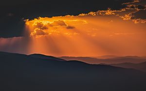 Preview wallpaper mountains, sunset, clouds, rays, dusk