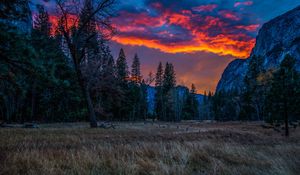 Preview wallpaper mountains, sunset, evening, grass, trees