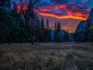 Preview wallpaper mountains, sunset, evening, grass, trees