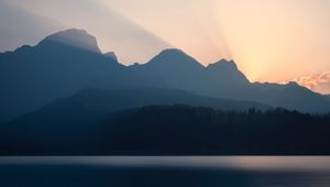 Preview wallpaper mountains, sunset, lake, light, sky, silence