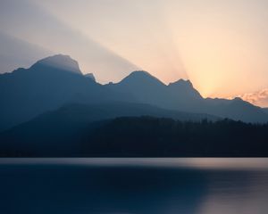 Preview wallpaper mountains, sunset, lake, light, sky, silence